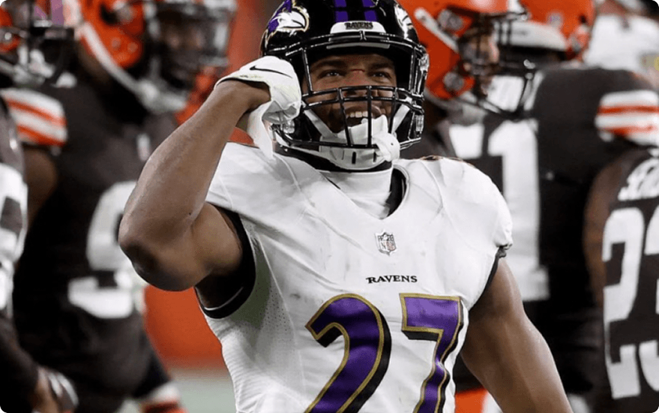 Baltimore Ravens running back J.K. Dobbins (number 27) celebrating on the field during a game